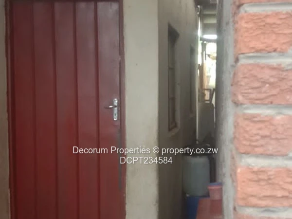 Brick-Front 4-Bed Walled Home in Ruwa — Tiled Floors