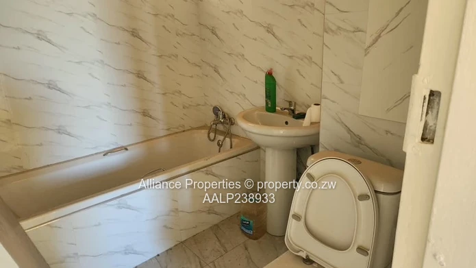 2-Bed Eastlea Flat, Harare — Bright Rooms & Tiled Bath