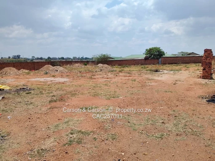 Walled 3800 m² Industrial Site in Chitungwiza — Gate & Gravel Access