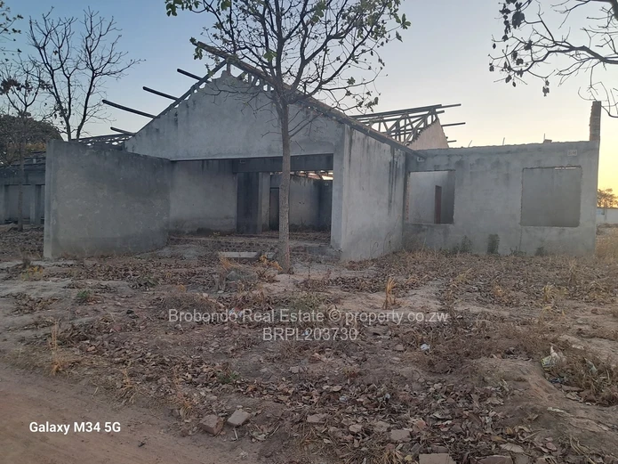 Incomplete house on roof level. 