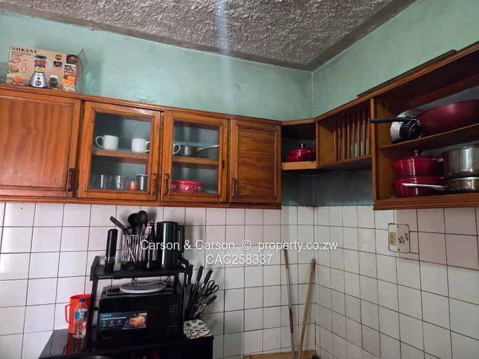 Mufakose 2 bedroom flat lounge fitted kitchen combined toilet and bathroom on ground floor 