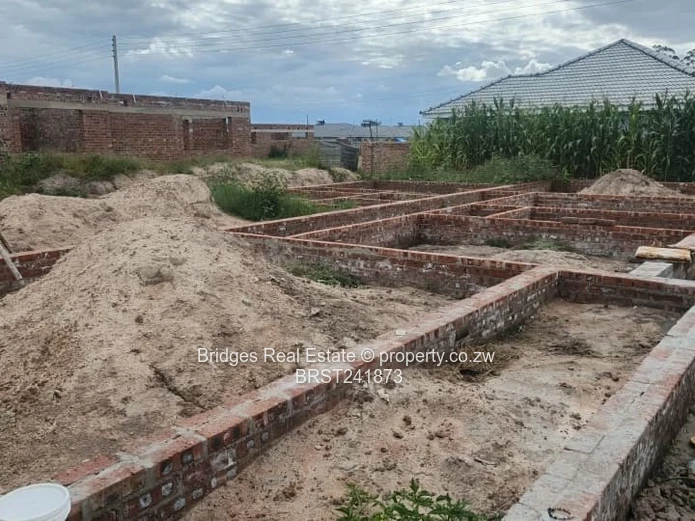 Serviced Residential Stand for Sale with Unfinished Structure