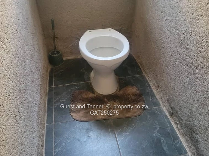 A neat 7-roomed, 4-bedroom house sitting on 200m², ideal for a family or as an investment property.
