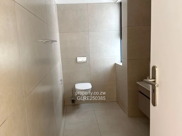 Contemporary 4-Bed Borrowdale Apt — Balcony & Borehole
