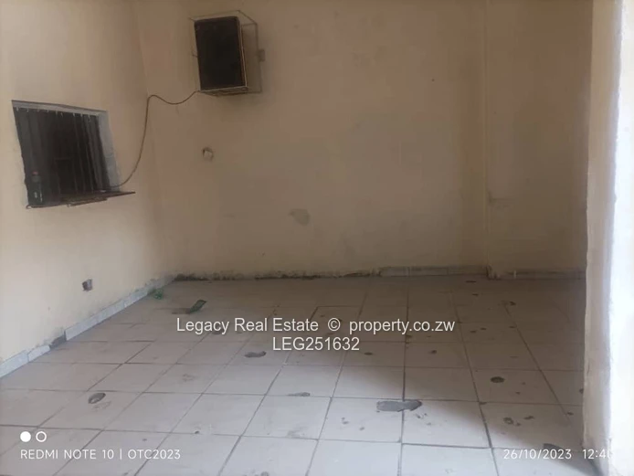Tiled, High-Ceiling Retail Shop with Service Hatch — Chitungwiza