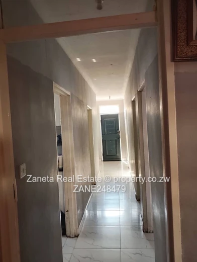 4-Bed, 2-Bath Manyame Park Home — Tiled Hallway & Carport