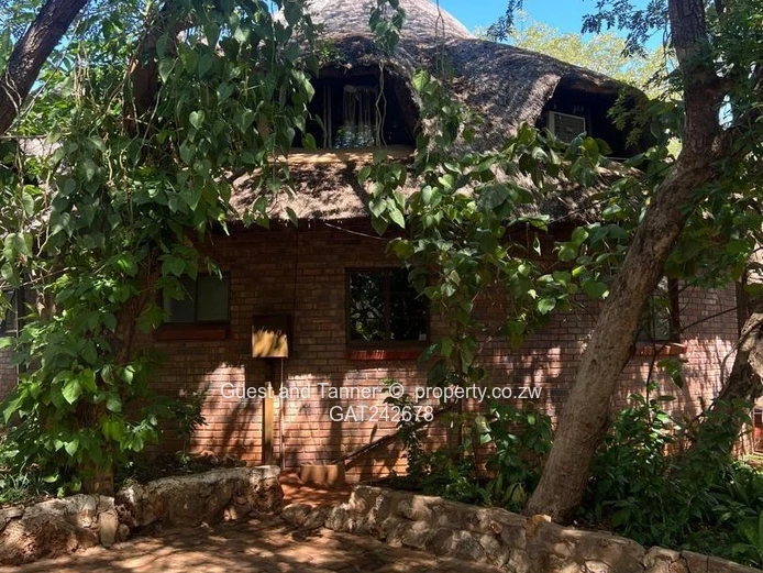 Ten bedroomed lodge under thatch for sale 