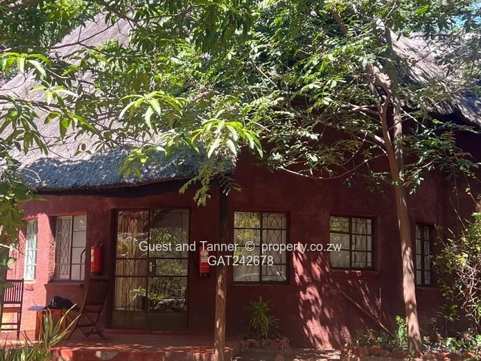 Ten bedroomed lodge under thatch for sale 