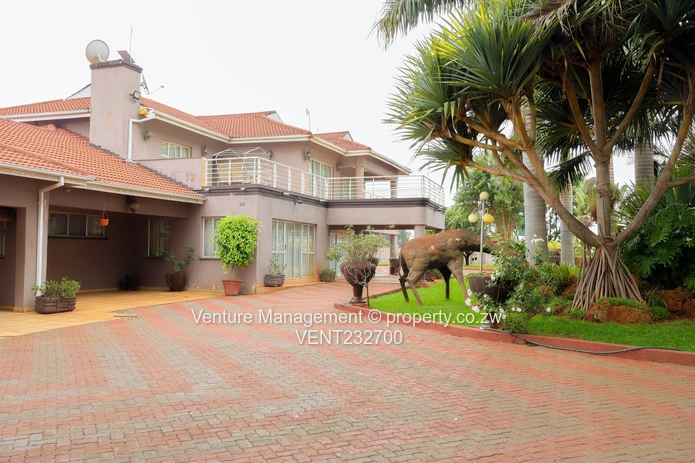 Immaculate 6 Bedroom Mansion with Cottage, Pool & Solar!