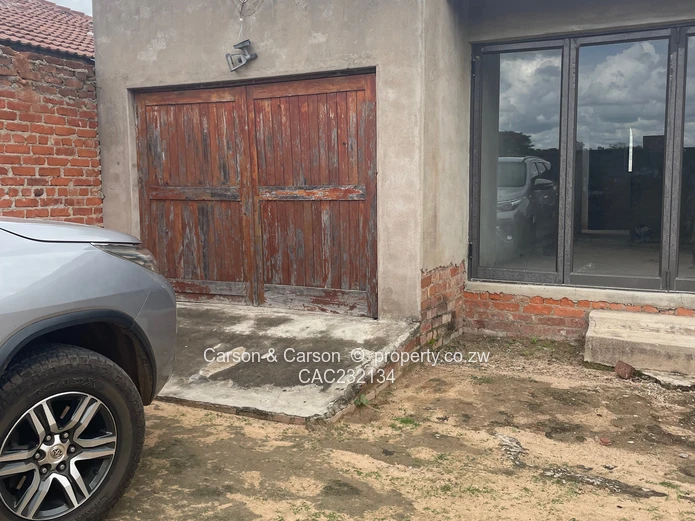 Walled 3-Bed Home with Verandah & Main Road Frontage