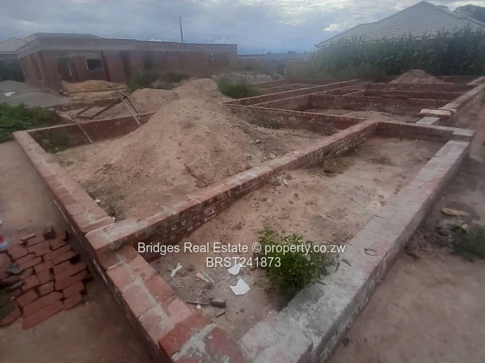 Serviced Residential Stand for Sale with Unfinished Structure