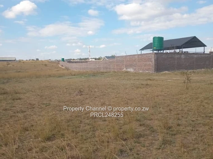 5,000 sqm Level Plot in 8km west of Gweru CBD — Open Grass, Adjacent Walled Property