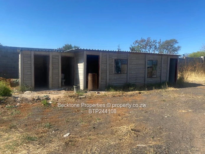 Spacious 2,420m² Walled Industrial Yard with Workshop — Bulawayo CBD