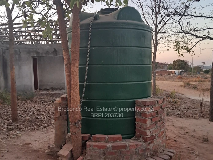 Incomplete house on roof level. 