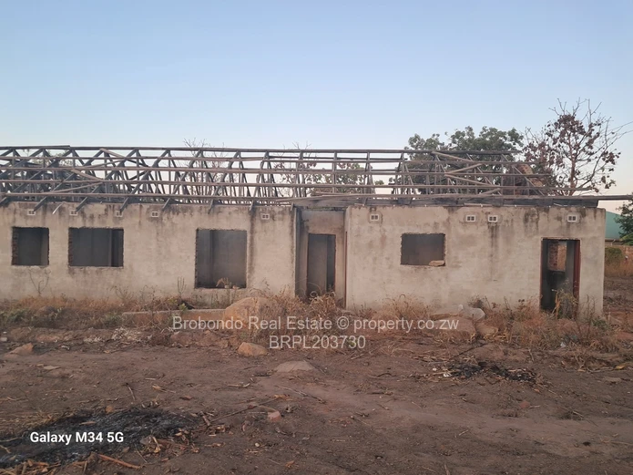 Incomplete house on roof level. 