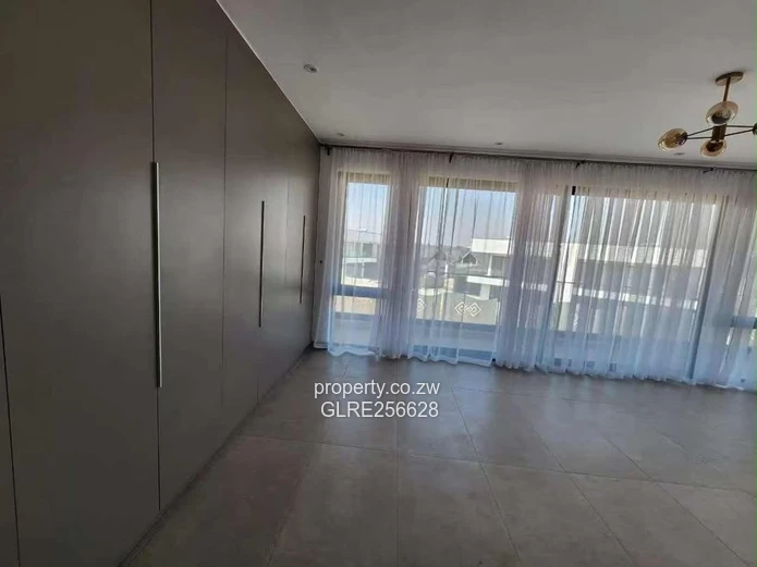Borrowdale: Modern 4-Bed Apt w/ Glass Balconies & Borehole