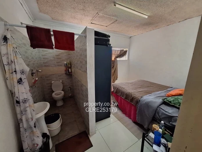 Brick 4-Bed Home — Verandah, Water Tank & Walled Yard