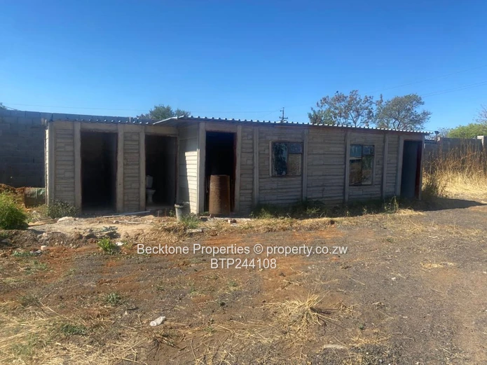 Spacious 2,420m² Walled Industrial Yard with Workshop — Bulawayo CBD