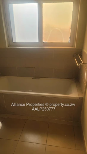 Spacious 2-Bed Ground Floor Flat with Borehole & Garden