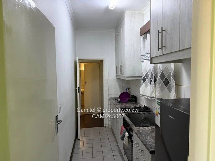 Chinamano Heights:Parquet-Floored 2-Bed Avenues Flat with Borehole (Sole Mandate)