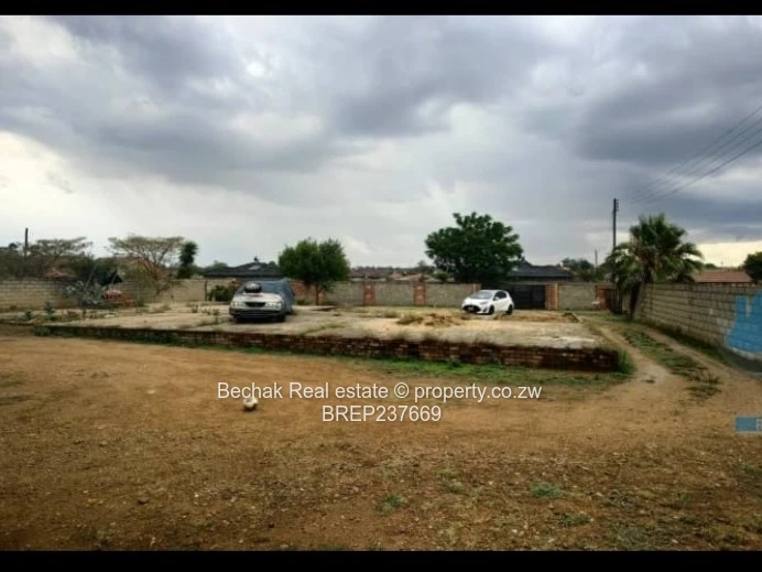 Walled 1BR on 1,200m² — Flatlet, Paved & Good ZESA