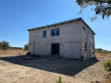 Two-Storey Property with Acreage and Potential