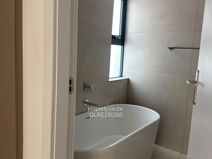 Contemporary 4-Bed Borrowdale Apt — Balcony & Borehole
