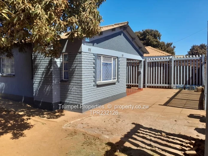 Grey 5-Bed Walled Home with Verandah & Paved Yard, Kuwadzana