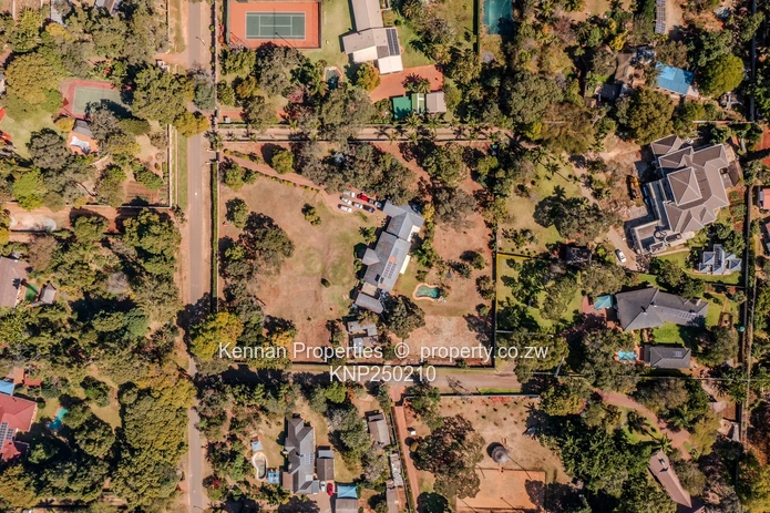 Attractive five bedroom home on two and a half acres. Good water and Msasa trees. (Sole Mandate)