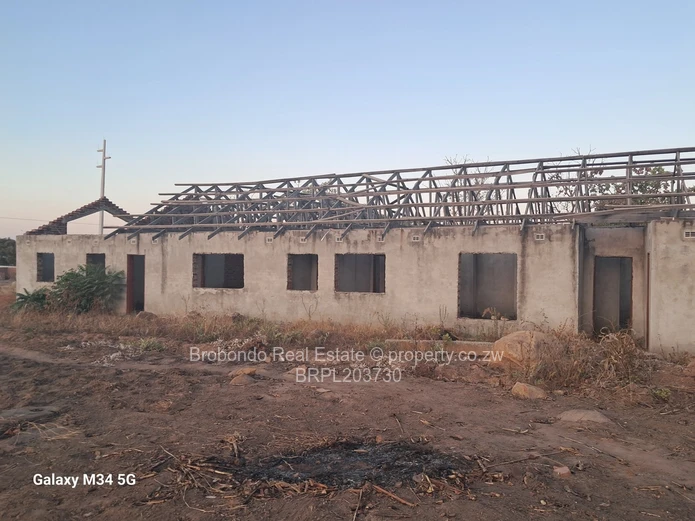 Incomplete house on roof level. 