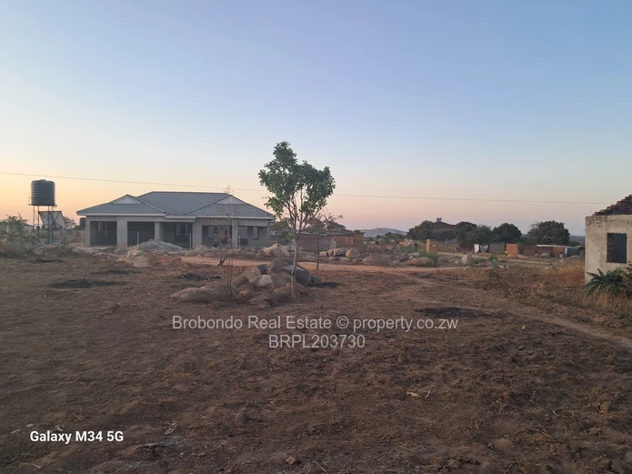 Incomplete house on roof level. 