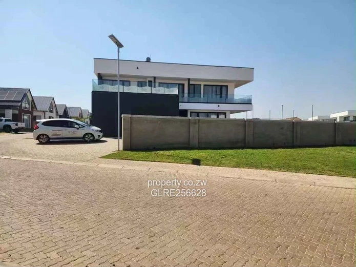 Borrowdale: Modern 4-Bed Apt w/ Glass Balconies & Borehole
