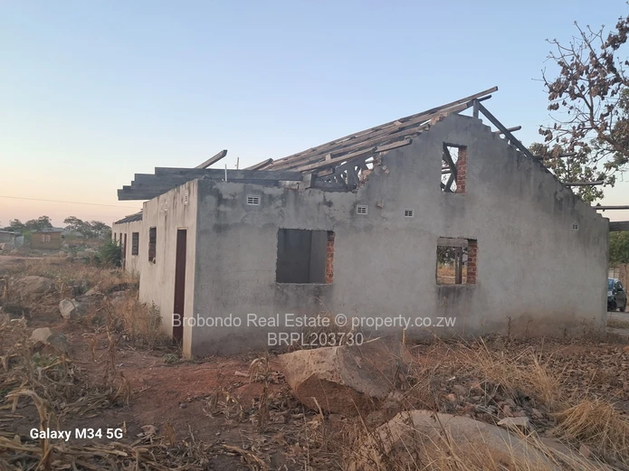 Incomplete house on roof level. 