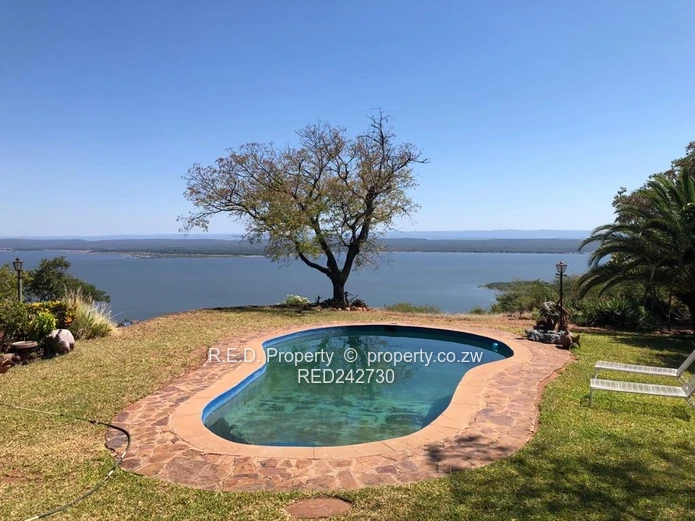 A Brick Under Tile Home In Binga