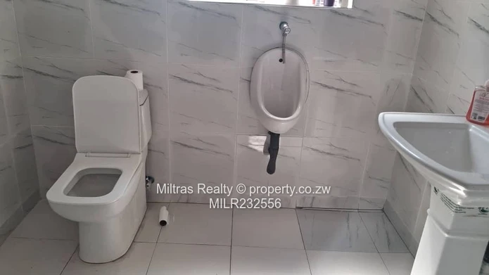 Eastlea Commercial: 1,100m² w/ Paved Yard & Borehole