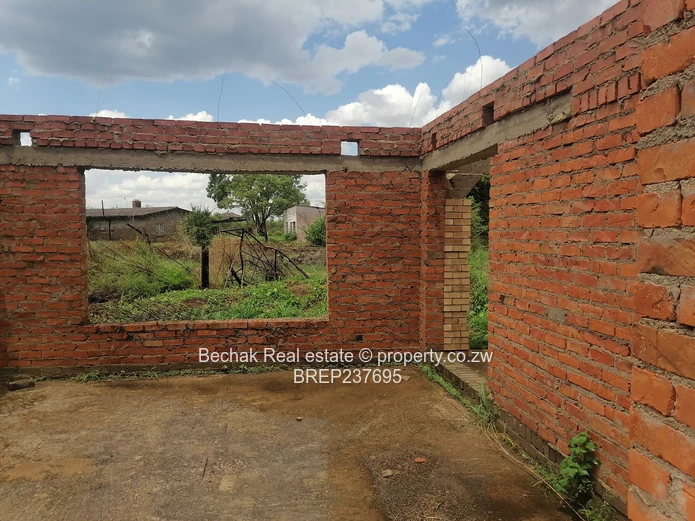 4-Bed Reigate Brick Shell on Main Road