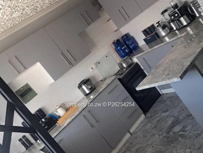 A four bedroomed house for sale in Mainway Meadows, Waterfalls in Harares