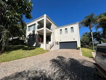 Stunning Split Level Home Set Is A Beautifully Crafted Garden With Water