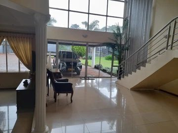 "Elegance Defined: A Grand Acre Retreat with Panoramic Views"