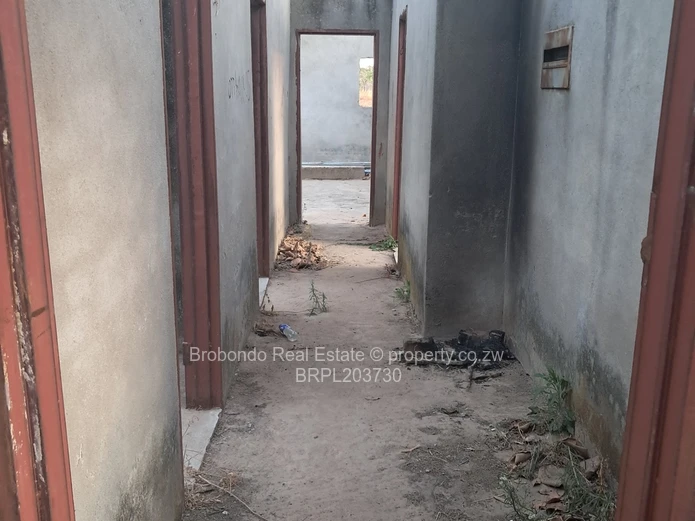 Incomplete house on roof level. 