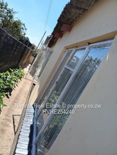 Walled 4-Bed Brick Home in Chitungwiza — Secure Verandah