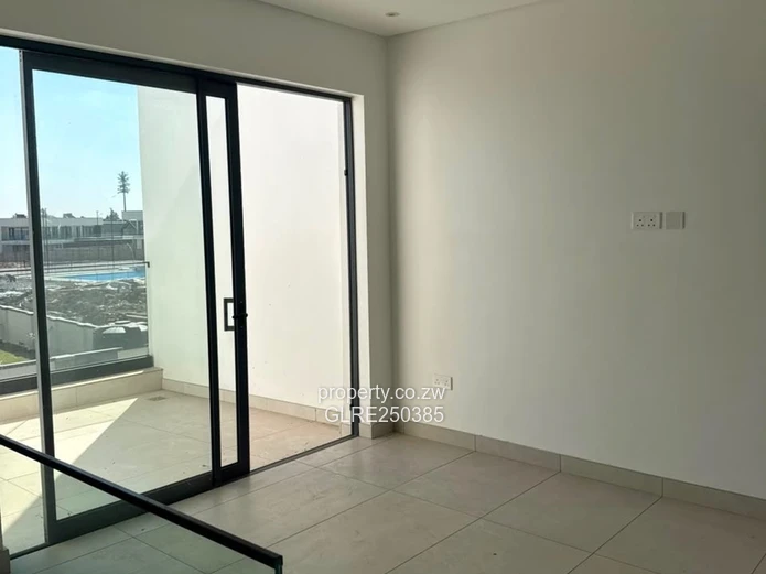 Contemporary 4-Bed Borrowdale Apt — Balcony & Borehole