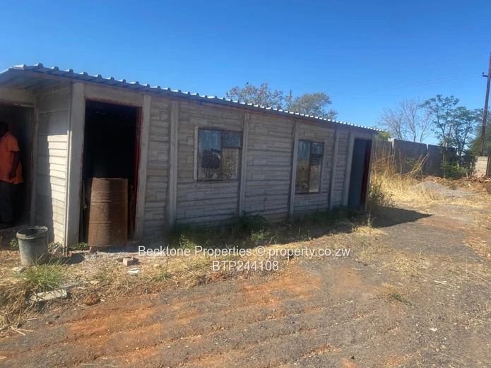 Spacious 2,420m² Walled Industrial Yard with Workshop — Bulawayo CBD