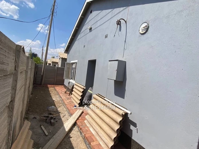 For Sale 4-Bed 2 Apartments Townhouse Complex in Budiriro Cabs  - Walled, Paved, Fitted Kitchens