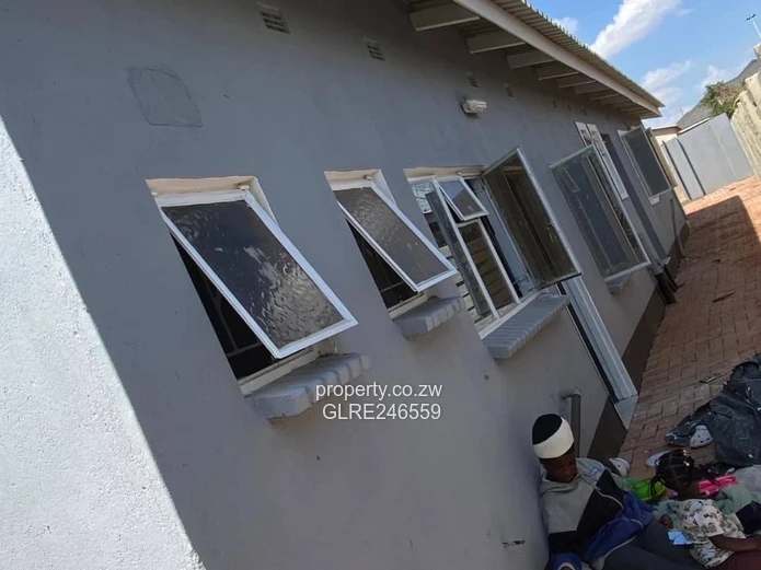 For Sale 4-Bed 2 Apartments Townhouse Complex in Budiriro Cabs  - Walled, Paved, Fitted Kitchens