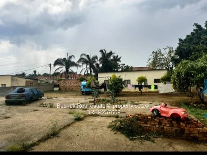 Walled 1BR on 1,200m² — Flatlet, Paved & Good ZESA