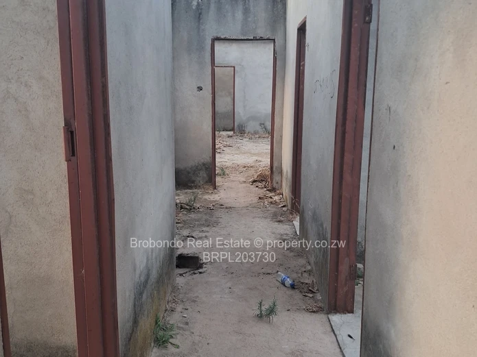 Incomplete house on roof level. 