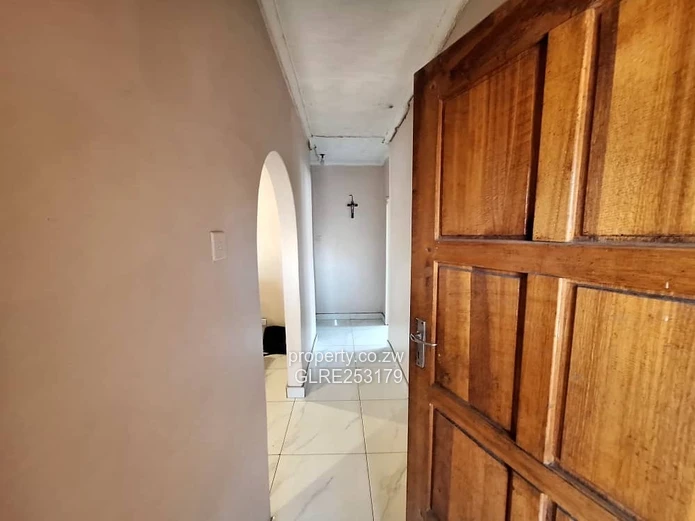 Brick 4-Bed Home — Verandah, Water Tank & Walled Yard