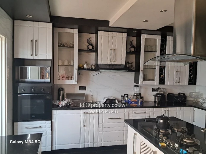 Spacious 4-Bed Home in Marimba Park — Garage & Fitted Kitchen