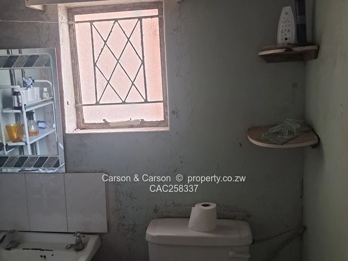 Mufakose 2 bedroom flat lounge fitted kitchen combined toilet and bathroom on ground floor 